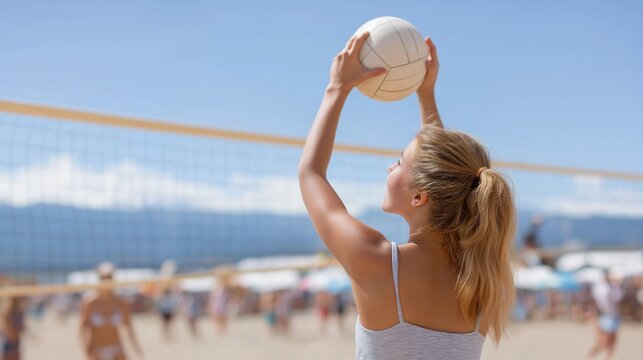 A girl raises her arms to set a volleyball in a sunny beach match, framed with a clear blue sky and ocean in the background. The energy of the active moment, paired with natural lighting and blurred 