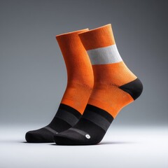 Bright orange and black athletic socks.  Features a white band on the upper part of the sock