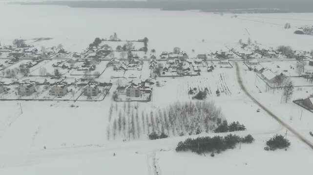 Aerial Drone Shot of Old Soviet Truck Driving Through Snowy Rural Landscape in Harsh Russian Winter