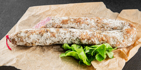 Dry-cured sausage pork meat smoked food fresh delicious gourmet food background on the table rustic food top view copy space
