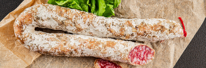 Dry-cured sausage pork meat smoked food fresh delicious gourmet food background on the table rustic food top view copy space