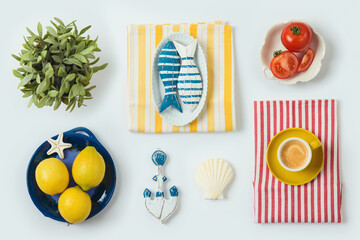 Mediterranean trendy summer concept with coffee cup, lemons, tomatoes fish and seashell isolated on white background. Top view, flat lay