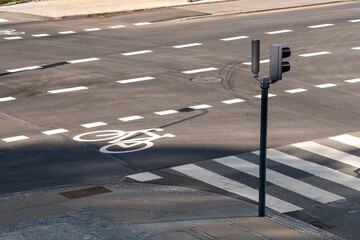 Multiple bicycle lane signs painted on asphalt at an intersection in Copenhagen showcasing the city’s bike-friendly infrastructure