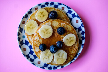 Fresh Pancakes With Sliced Banana Blueberries And Honey