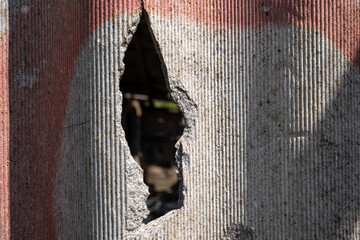 Old and very dangerous asbestos roof. Asbestos dust in the environment. Asbestos removal