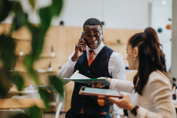 Two business people positively collaborating in a modern workspace. Professional attire, collaboration setting, thriving communication in a vibrant co working office.