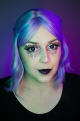 Valentine's Day fantasy makeup with a galactic twist. Purple wig, violet eyes, and starry eye makeup create a dreamy, cosmic lover vibe.