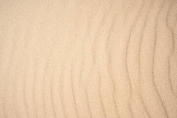 Top view on the sand dunes. The texture of sand
