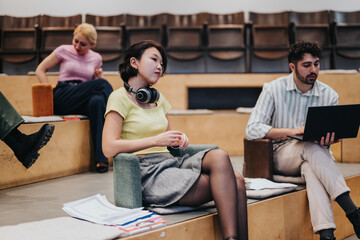 An image depicting a group of diverse people engaged in a collaborative discussion in a modern...