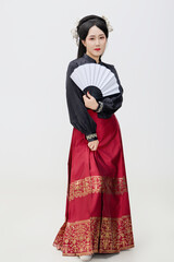 Chinese woman wearing Chinese Ming Dynasty Hanfu on black background