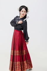 Chinese woman wearing Chinese Ming Dynasty Hanfu on black background