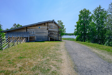 Wooden house of the 19th century with carved platbands on the windows near Onega Lake on Kizhi Island in Karelia