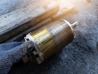 Checking the iron rotor on the electric motor, there are traces of friction due to unstable...