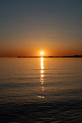 sunset in beautiful colours over lake constance seen from Bregenz towards the island of Lindau