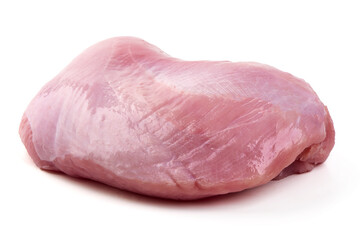 Raw turkey breast fillet on black slate plate, isolated on white background.