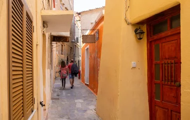 Photo sur Plexiglas Chania old town architecture. Crete island, Greece. Traditional buildings on a narrow cobblestone alley