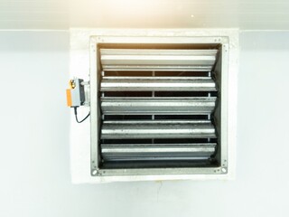 Close up the air damper actuator with automation open  close  damper blades on the ventilation duct.
