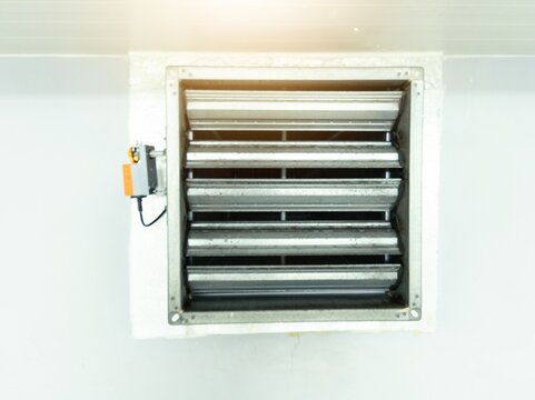 Close up the air damper actuator with automation open  close  damper blades on the ventilation duct.