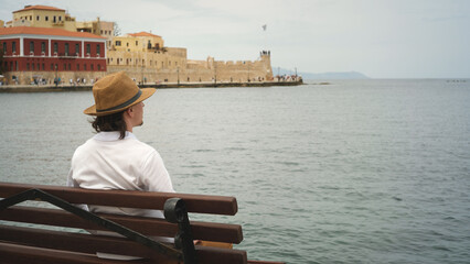Tourist admiring venetian fortress koules in heraklion, crete, greece
