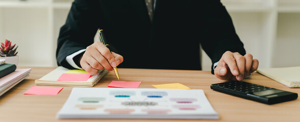 Close-up of hands working with computer tablet in modern office. Preparing accounting analysis...