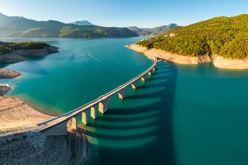 Serre-Poncon Lake with aerial view of Chanteloube Bay and abandoned railroad bridge. Durance Valley in Hautes-Alpes (Alps), France