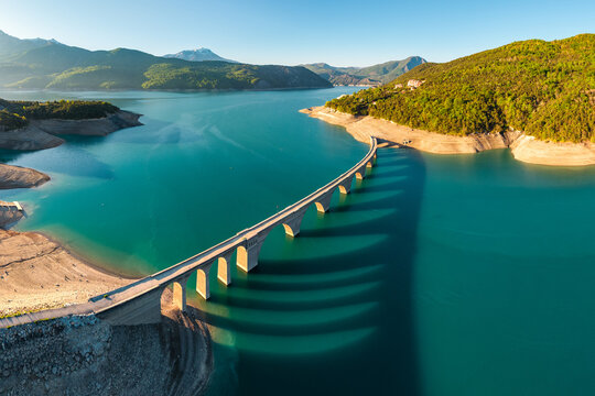 Serre-Poncon Lake with aerial view of Chanteloube Bay and abandoned railroad bridge. Durance Valley in Hautes-Alpes (Alps), France