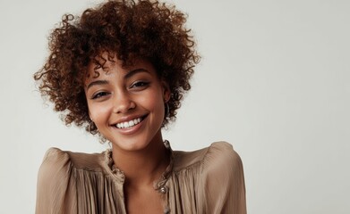 A radiant black woman with curly hair showcases her natural beauty, smiling with ease in a confident pose, her elegance reflecting inner peace.