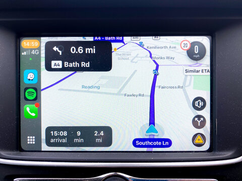 Reading, UK - May 21 2025: Waze satellite navigation software giving directions via a car infotainment system connected via Apple Car Play
