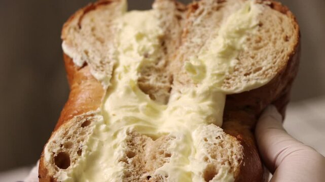 Cross section of a bagel filled with cream cheese