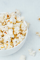 Perfectly popped popcorn served in a white bowl ready for movie night