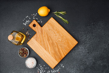 Wooden cutting board with ingredients for fresh cooking preparation