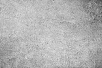 Light gray concrete wall surface with subtle scratches and textured background