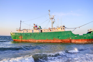Fototapeta premium A North Korean Unpha vessel stranded off Vladivostok, Russia, highlights maritime distress in the Sea of Japan waters with North Korea flag. 