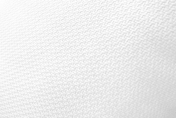 close-up shot of a white woven fabric, showcasing its detailed texture and pattern, ideal for use as a neutral background in various design projects.
