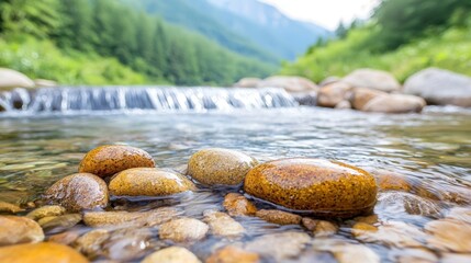 the clear water trickled down smooth rocks, creating a gentle cascade that sparkled in the sunlight and exuded a refreshing, rejuvenating aura.