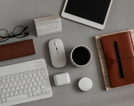 A office table with gadgets and accessories for studying and learning. Business, education, work concept