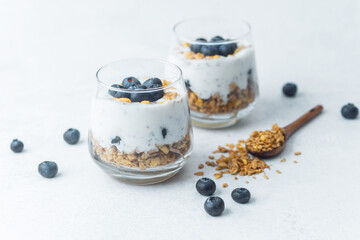 Yogurt granola parfaits topped with fresh blueberries