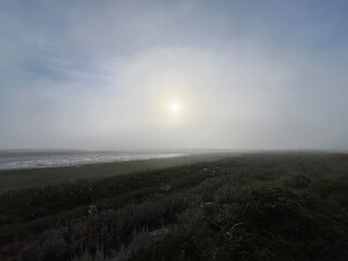 morning fog over the beach and sea