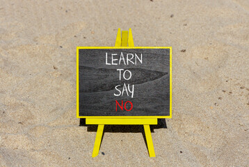 Learn to say no symbol. Concept words phrase Learn to say no on beautiful black blackboard....