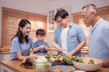 Happy Asian family preparing food together in a bright kitchen,