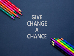Give change a chance symbol. Concept words phrase Give change a chance on beautiful black paper....