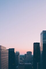 Obraz premium serene urban skyline captured from high vantage point at dawn bathed in soft morning light