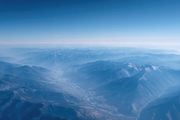 Fototapeta premium aerial view showcasing vast mountain range with winding rivers capturing expanse from above