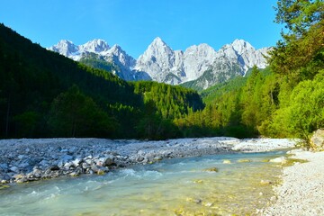View of Martuljek mountain range in Julian alps, Gorenjska, Slovenia and Martuljek stream bellow