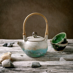 Ceramic teapot with wooden handle