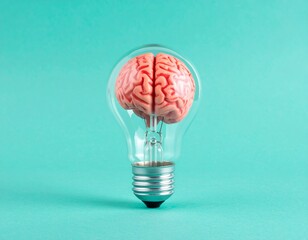 startup entrepreneur concept light bulb shaped like a brain on a teal background