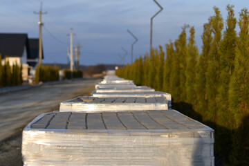 Suburban street under construction with paving materials and landscape design