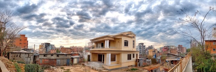 photo of gentrification with one mansion surrounded by slums 