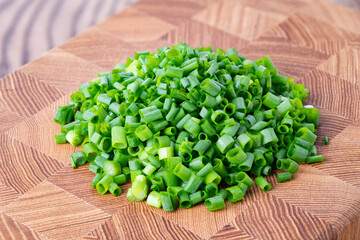 Chopped Green Onions on Wooden Background