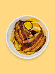 Chinese food pork belly dish with boiled egg and pieces of chayote cooked in curry sauce. Home cooking usually served during Chinese New Year